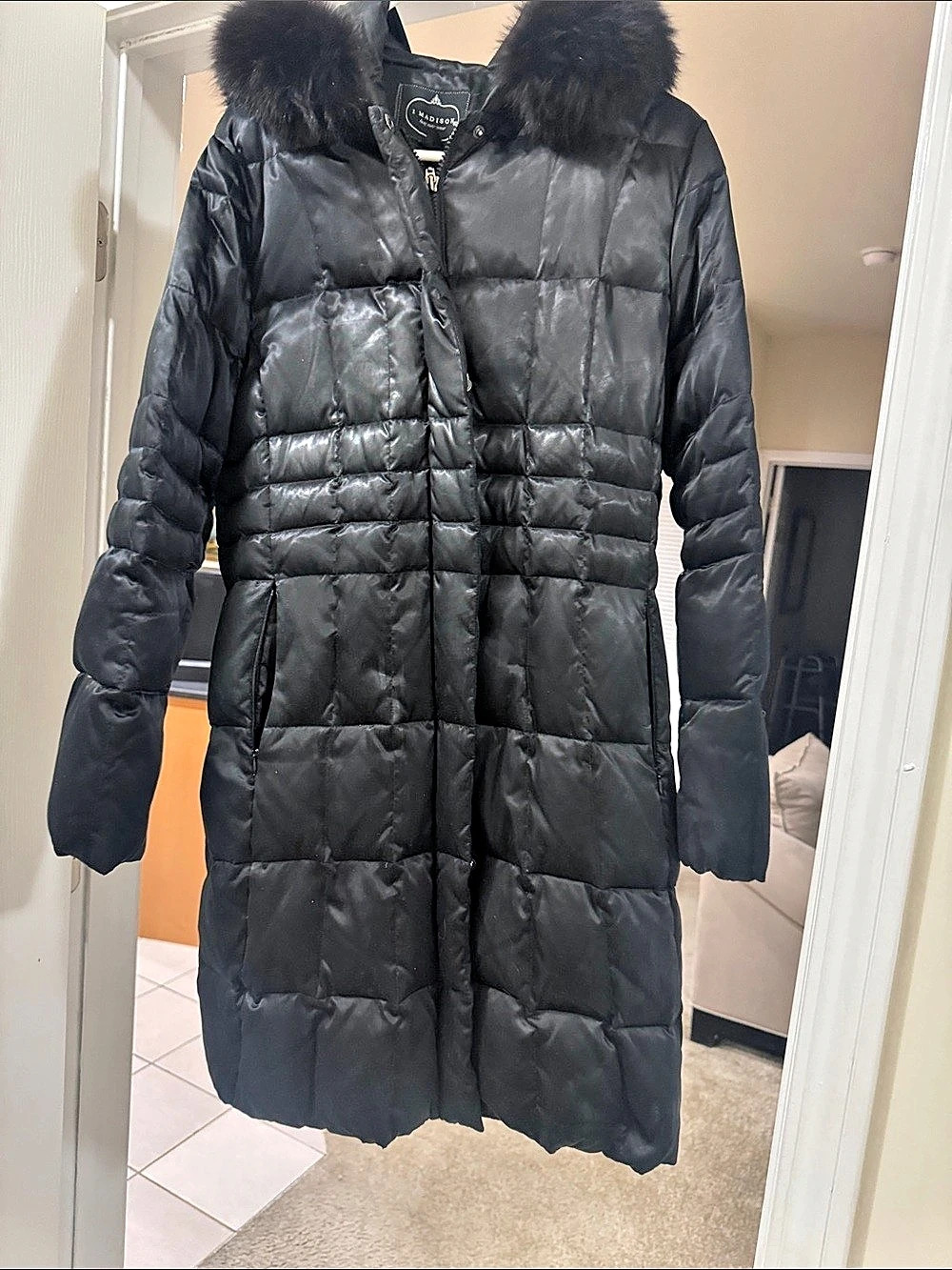 1madison puffer coat with fur trimmed hood,quilted construction,and zip front cl